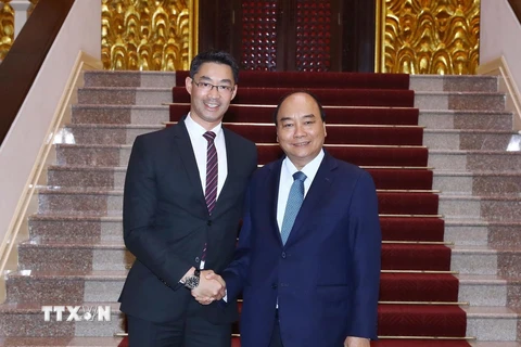 Thủ tướng Nguyễn Xuân Phúc tiếp chuyên gia kinh tế Philipp Rösler nhân chuyến thăm và làm việc tại Việt Nam. (Ảnh: Thống Nhất/TTXVN)