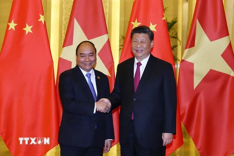 Thủ tướng Nguyễn Xuân Phúc hội kiến Tổng Bí thư, Chủ tịch nước Trung Quốc Tập Cận Bình. (Ảnh: Thống Nhất/TTXVN)
