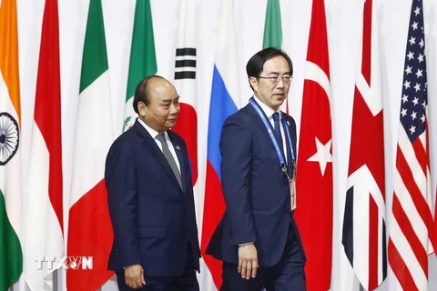 Lễ đón Thủ tướng Nguyễn Xuân Phúc dự Hội nghị cấp cao Nhóm các nền kinh tế phát triển và mới nổi hàng đầu thế giới (G20). (Ảnh: Thống Nhất/TTXVN)