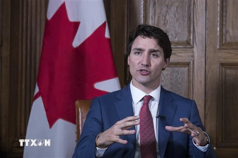 Thủ tướng Canada Justin Trudeau phát biểu với báo giới tại Ottawa. (Ảnh: AFP/TTXVN)