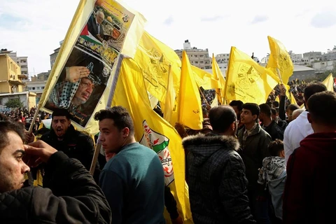 Hàng nghìn người ủng hộ phong trào Fatah đổ xuống các đường phố ở Dải Gaza. (Nguồn: AP)