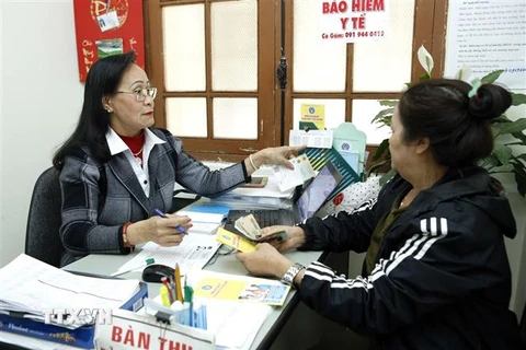 Hệ thống đại lý Bảo hiểm y tế tuyên truyền vận động người dân tham gia Bảo hiểm y tế tại thành phố Đà Lạt. (Ảnh: DươngNgọc/TTXVN)