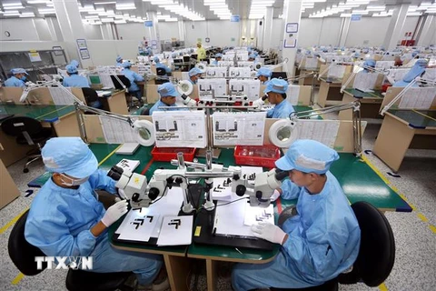 Việt Nam đang đẩy mạnh công nghiệp hóa, hiện đại hóa và hội nhập quốc tế. (Ảnh: Danh Lam/TTXVN)