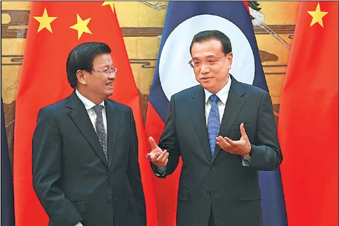 Thủ tướng Lào Thongloun Sisoulith (trái) và người đồng cấp Trung Quốc Lý Khắc Cường sẽ đồng chủ trì hội nghị . (Nguồn: China Daily)