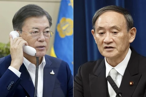 Thủ tướng Nhật Bản Yoshihide Suga (phải) và Tổng thống Hàn Quốc Moon Jae-in. (Nguồn: Yonhap)