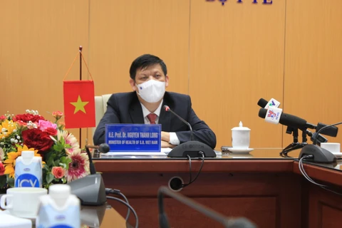 Bộ trưởng Bộ Y tế Nguyễn Thanh Long phát biểu tại cuộc trao đổi trực tuyến với Bộ trưởng Bộ Y tế Lào Bounfeng Phoummalaysith. (Nguồn: suckhoedoisong.vn)