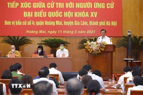 Ứng cử viên đại biểu Quốc hội khóa XV, Ủy viên Bộ Chính trị, Bí thư Thành ủy Hà Nội Đinh Tiến Dũng trình bày chương trình hành động. (Ảnh: Văn Điệp/TTXVN)