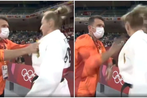 Huấn luyện viên Pusa dùng tay lắc mạnh và tát vào mặt nữ vận động viên Martyna Trajdos. (Nguồn: Twitter)