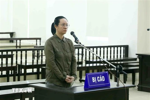 Bị cáo Ngụy Thị Khanh tại phiên toà phúc thẩm. (Ảnh: Phạm Kiên/TTXVN)