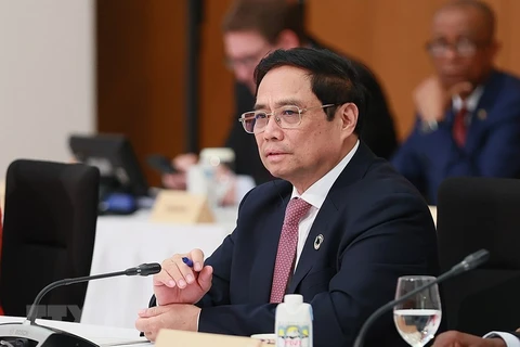 Thủ tướng Phạm Minh Chính tại một phiên thảo luận. (Ảnh: Dương Giang/TTXVN)
