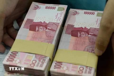 Đồng rupiah của Indonesia. (Ảnh: AFP/TTXVN)