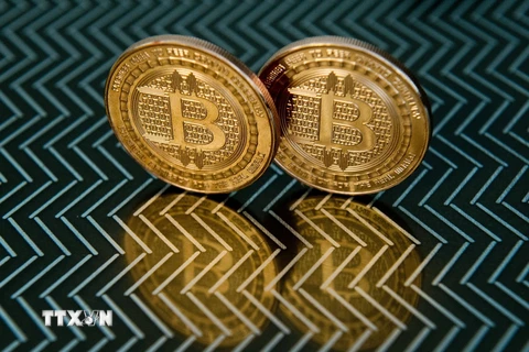 Đồng tiền kỹ thuật số bitcoin. (Ảnh: AFP/TTXVN)