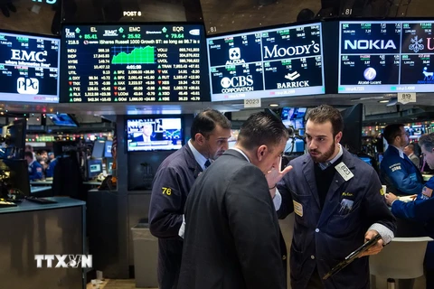 Sàn giao dịch chứng khoán New York ngày 4/12 vừa qua. (Ảnh: AFP/TTXVN)