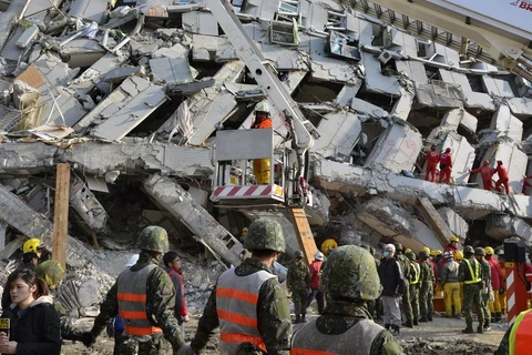 Hiện trường vụ sập chung cư do động đất ngày 6/2 vừa qua. (Ảnh: AFP/TTXVN)