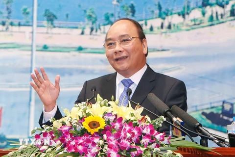 Thủ tướng Nguyễn Xuân Phúc dự và phát biểu tại Hội nghị xúc tiến đầu tư và quảng bá du lịch vào tỉnh Lai Châu lần thứ nhất. (Ảnh: Thống Nhất/TTXVN)