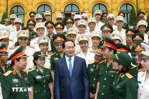 Chủ tịch nước Trần Đại Quang với các đại biểu tại buổi gặp mặt. (Ảnh: Nhan Sáng/TTXVN)
