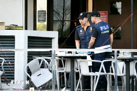 Cảnh sát Malaysia điều tra tại hiện trường một vụ tấn công. (Ảnh: AFP/TTXVN) 