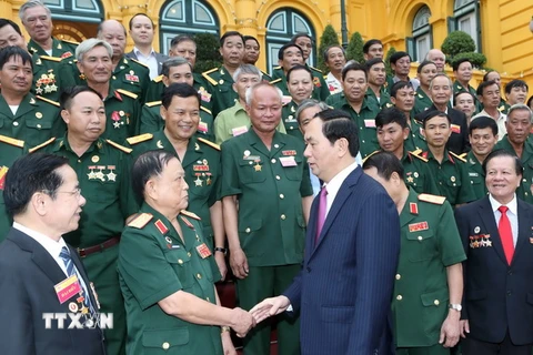 Chủ tịch nước Trần Đại Quang với các đại biểu tại buổi gặp mặt. (Ảnh: Nhan Sáng/TTXVN)