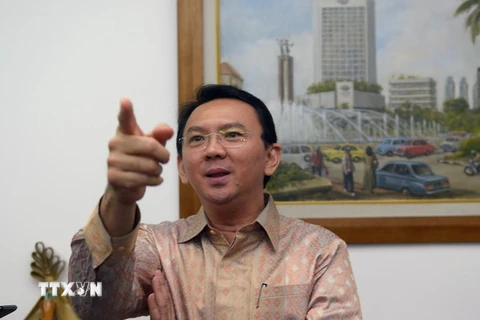 Thị trưởng thành phố Jakarta Basuki Tjahaja Purnama phát biểu trước báo giới tại thành phố Jakarta ngày 14/8/2014. (Ảnh: AFP/TTXVN)