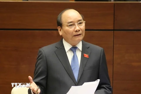Thủ tướng Chính phủ Nguyễn Xuân Phúc trả lời chất vấn các đại biểu quốc hội. (Ảnh: Phương Hoa/TTXVN)