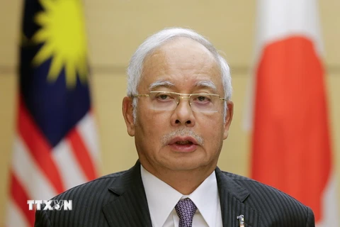Thủ tướng Malaysia Najib Razak trong cuộc họp báo ở Tokyo ngày 16/11 vừa qua. (Ảnh: AFP/TTXVN)