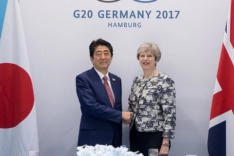 Thủ tướng Nhật Bản Shinzo Abe và người đồng cấp Vương quốc Anh Theresa May. (Nguồn: PA)