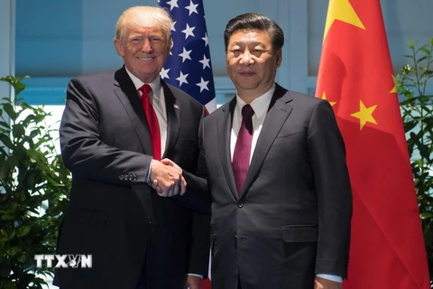 Chủ tịch Trung Quốc Tập Cận Bình và Tổng thống Mỹ Donald Trump. (Ảnh: AFP/TTXVN)