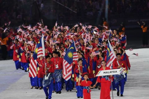 Các vận động viên và quan chức Malaysia trong lễ khai mạc SEA Games 29. (Nguồn: AFP)