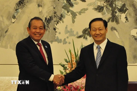 Phó Thủ tướng Thường trực Chính phủ Trương Hòa Bình đã tiếp Bí thư Khu ủy Khu Tự trị Dân tộc Choang Quảng Tây Bành Thanh Hoa. (Ảnh: Lê Trung Kiên/TTXVN)