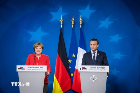 Tổng thống Pháp Emmanuel Macron và Thủ tướng Đức Angela Merkel. (Ảnh: AFP/TTXVN)