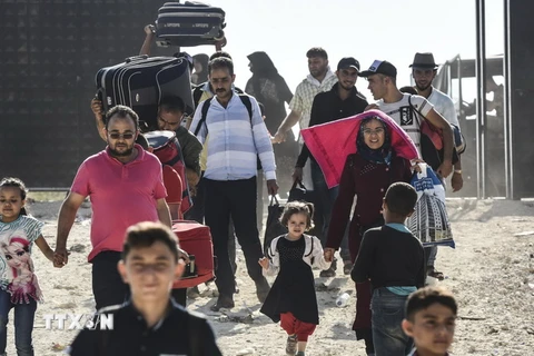 Hàng chục nghìn người tị nạn Syria tại Thổ Nhĩ Kỳ đang tạm thời trở về quê nhà để tham gia dịp lễ Eid al-Adha ngày 27/8 vừa qua. (Ảnh: AFP/TTXVN)