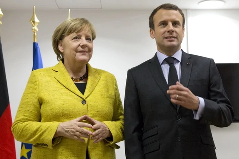 Thủ tướng Đức Angela Merkel và Tổng thống Pháp Emmanuel Macron. (Ảnh: AFP/TTXVN)
