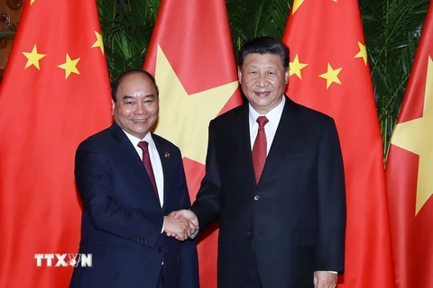 Thủ tướng Nguyễn Xuân Phúc và Tổng Bí thư, Chủ tịch Trung Quốc Tập Cận Bình. (Ảnh: Thống Nhất/TTXVN)