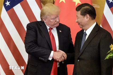 Tổng thống Mỹ Donald Trump (trái) và Chủ tịch Trung Quốc Tập Cận Bình. (Ảnh: AFP/TTXVN)