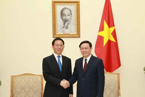 Phó Thủ tướng Vương Đình Huệ tiếp Phó Bí thư Tỉnh ủy Vân Nam của Trung Quốc Vương Dư Ba. (Ảnh: Doãn Tấn/TTXVN)