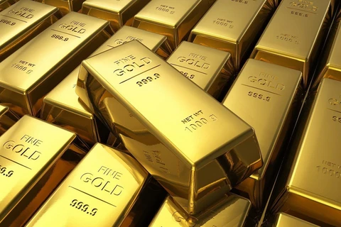 Giá vàng Mỹ giao kỳ hạn cũng giảm 0,7% xuống còn 1.463 USD/ounce. (Ảnh: AFP/TTXVN)