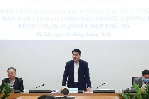 Chủ tịch UBND thành phố Hà Nội Nguyễn Đức Chung phát biểu kết luận phiên họp giao ban công tác quý 1 năm nay. (Ảnh: Lâm Khánh/TTXVN)
