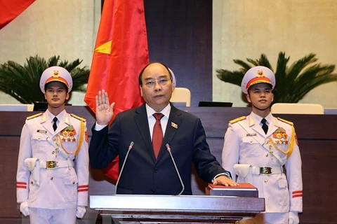 Chủ tịch nước Nguyễn Xuân Phúc tuyên thệ nhậm chức. (Ảnh: Thống Nhất/TTXVN)