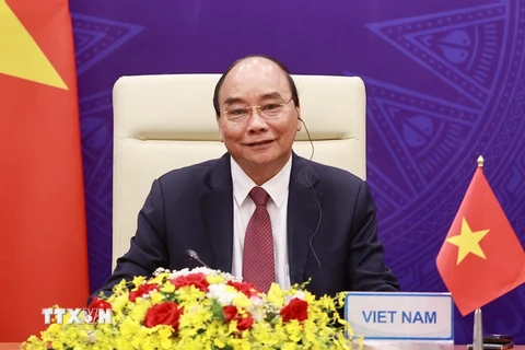 Chủ tịch nước Nguyễn Xuân Phúc tại điểm cầu Hà Nội. (Ảnh: Thống Nhất/TTXVN)