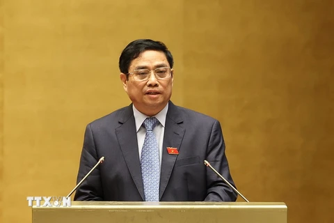 Thủ tướng Chính phủ Phạm Minh Chính trình bày Báo cáo. (Ảnh: Dương Giang/TTXVN)