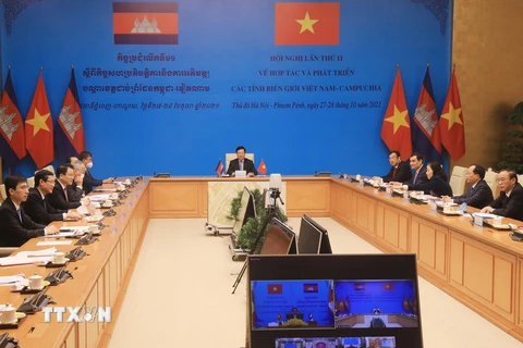 Phó Thủ tướng Thường trực Phạm Bình Minh và Phó Thủ tướng, Bộ trưởng Bộ Nội vụ Campuchia Samdech Sar Kheng đồng chủ trì Hội nghị. (Ảnh: Lâm Khánh/TTXVN)