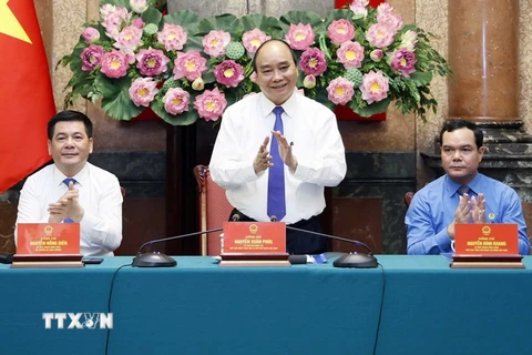 Chủ tịch nước Nguyễn Xuân Phúc tại buổi gặp mặt cán bộ, công nhân lao động tiêu biểu ngành Dầu khí. (Ảnh: Thống Nhất/TTXVN)