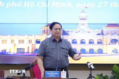Thủ tướng Phạm Minh Chính chủ trì làm việc với lãnh đạo chủ chốt TP Hồ Chí Minh. (Ảnh: Dương Giang/TTXVN)
