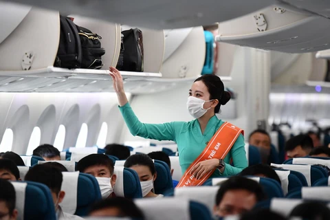 Nữ tiếp viên Vietnam Airlines trên chyến bay. (Nguồn: Vietnam Airlines)