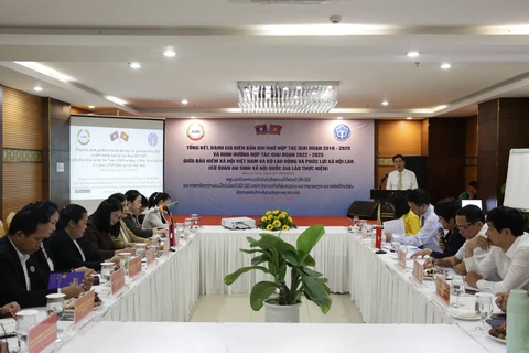 Đánh giá kết quả thực hiện Biên bản ghi nhớ hợp tác giai đoạn 2016-2020 giữa Bảo hiểm xã hội Việt Nam với Bộ Lao động và Phúc lợi xã hội Lào. (Ảnh: PV/Vietnam+)