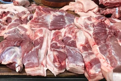 Thịt lợn tại chợ đang dần quay về giá của thời điểm đầu năm. (Ảnh minh họa: PV/Vietnam+)