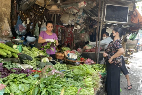 Giá thực phẩm tại các chợ vẫn tương đối ổn định. (Ảnh: PV/Vietnam+)