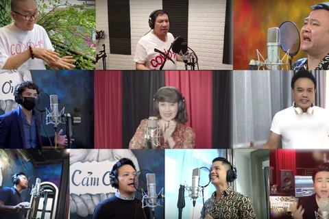 Các nghệ sỹ tham gia MV “Việt Nam ơi, cùng nhau đồng lòng.” (Ảnh: PV/Vietnam+) 