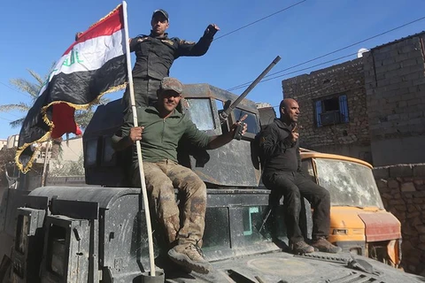 Quân đội Iraq tiến vào huyện al-Tareem của Ramadi hôm 9/12. (Ảnh: AFP/Getty)