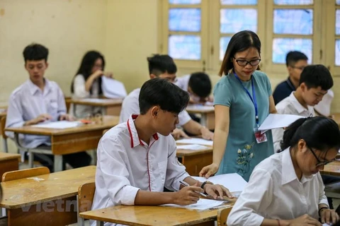 Thí sinh dự thi môn Ngữ văn, Kỳ thi Tuyển sinh vào lớp 10, tại Hà Nội, năm học 2019-2020. (Ảnh: PV/Vietnam+)